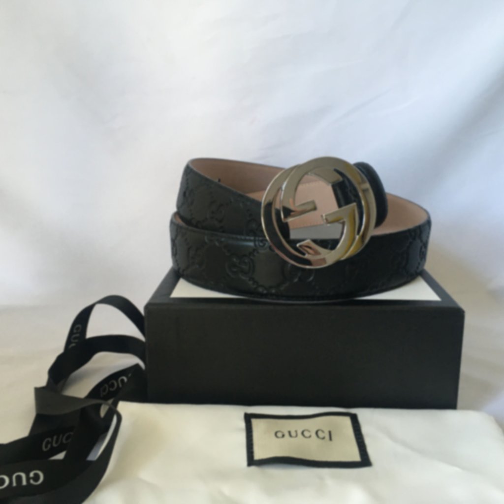 The Gucci Belt Is A Sophisticated Accessory Featuring A Black Leather Strap Ador